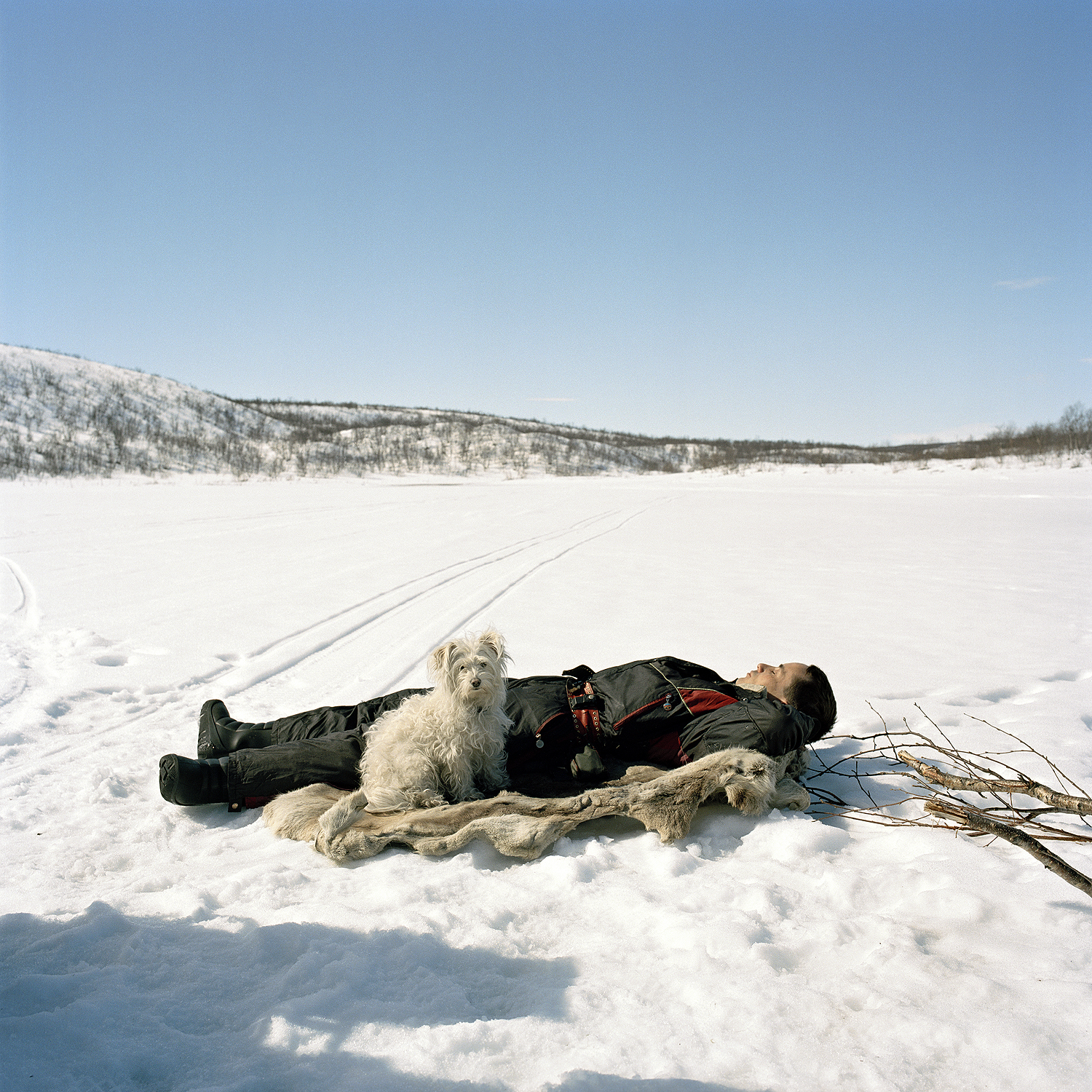 Ole Ailo sleeping on reindeer skin, 2005